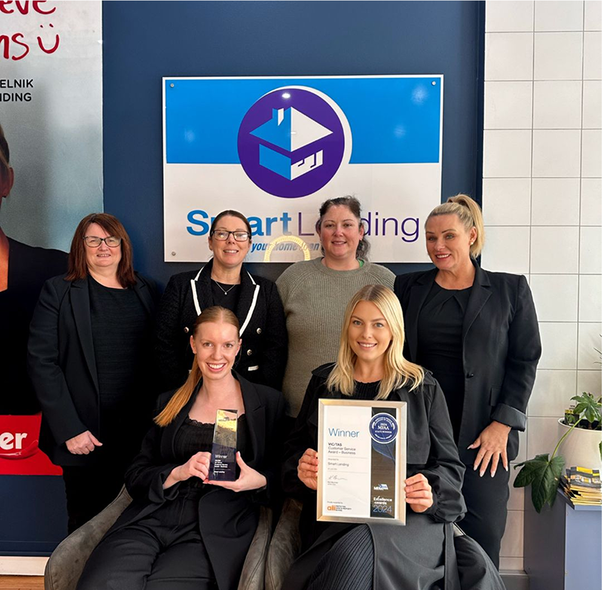 Smart Landing award-winning team celebrating their success in financial services.